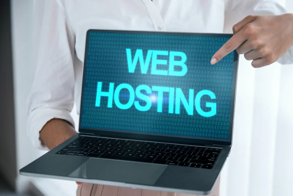 A person holding a laptop with a text of "Web Hosting"